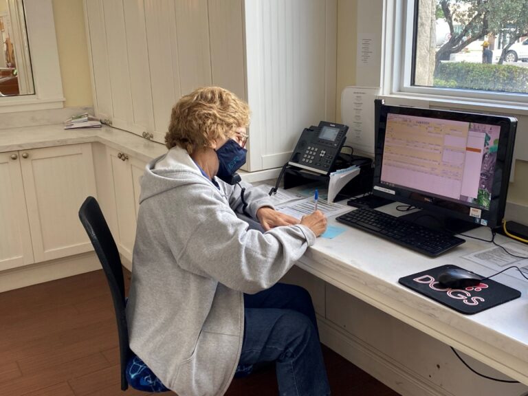 volunteer at desk